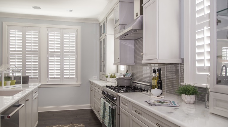 Polywood shutters in Phoenix kitchen with marble counter.